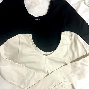 Long sleeve crop top:tight fitting. Black is size Large and white is size Medium